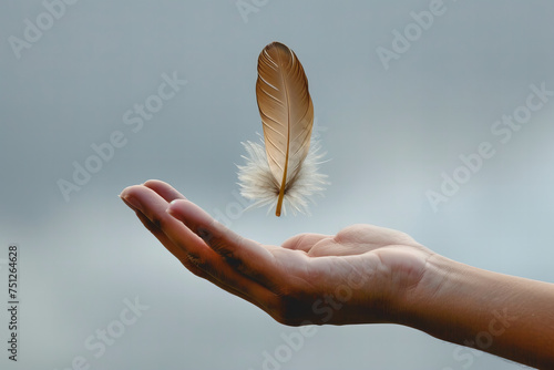 Gentle Hand Balancing Delicate Feather Against Calm Sky - Serenity Banner