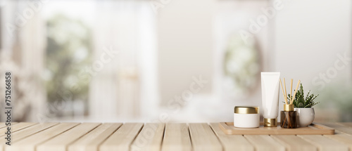 A set of facial cream and a presentation space on a wooden desk in a modern white bathroom. © bongkarn