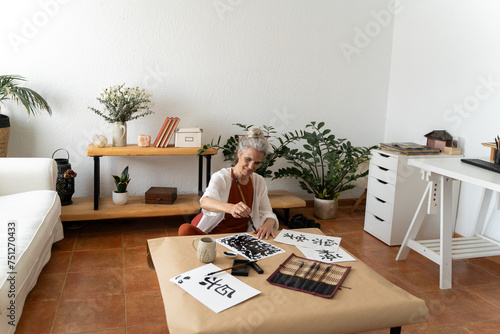 woman painting at living room photo