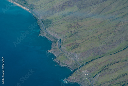 The West Maui Mountains, West Maui Volcano, or Mauna Kahālāwai which means "holding house of water,  shield volcano.	  Honoapiʻilani Highway
