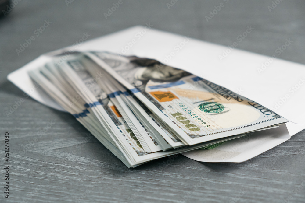 Close-up of money in an envelope. Concept of bribe, corruption, salary, earnings and financial savings. Close-up of money in an envelope. Concept of bribe, corruption, salary, earnings and financial savings.