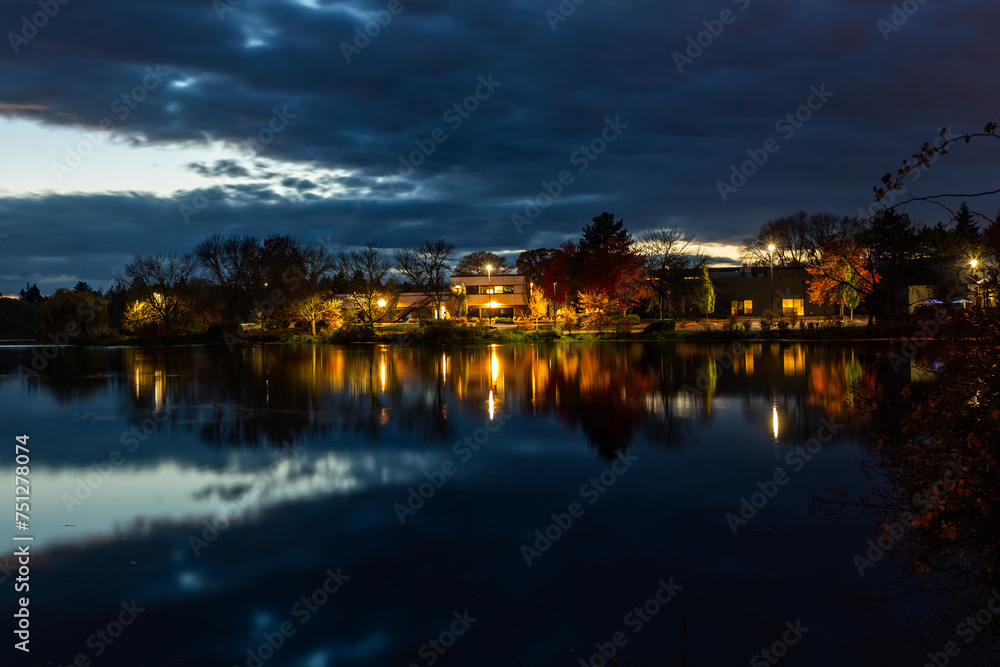 Lights reflection in an autumn pond at dusk. Beaverton, Oregon