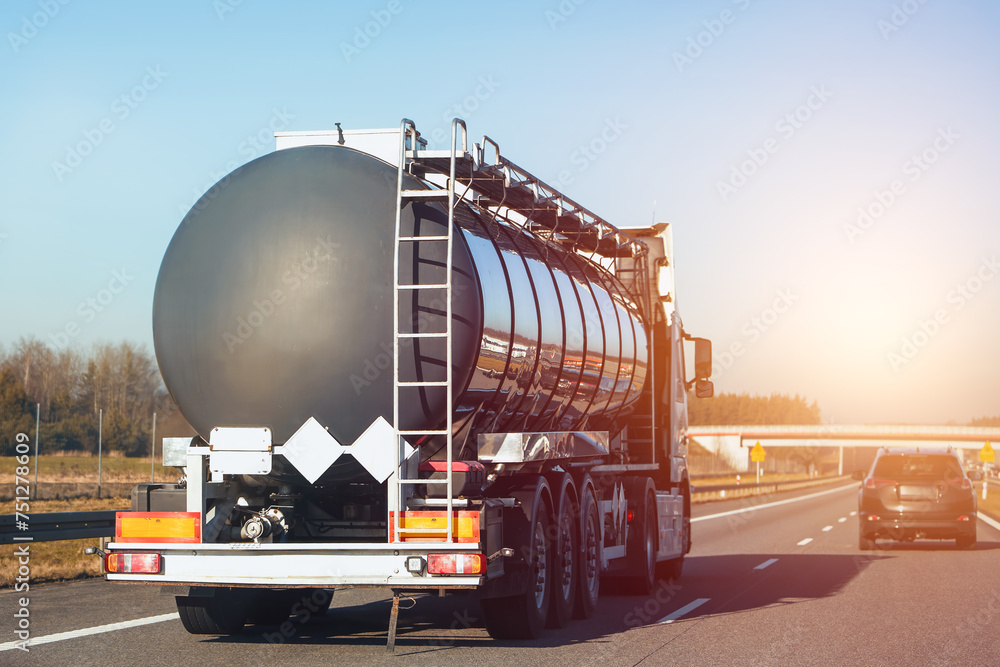 Gas and fuel transportation truck on highway. It ships oil and lpg. - obrazy, fototapety, plakaty 