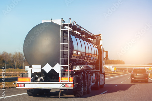 Gas and fuel transportation truck on highway. It ships oil and lpg. photo