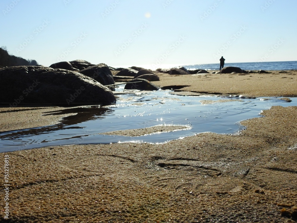 Sunny weather near the Seashore with stones and sun