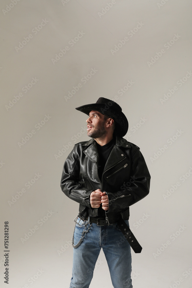Vertical headshot of smiling mature man wearing hat and posing over white wall. Vertical headshot of smiling mature man wearing hat and posing over white wall.