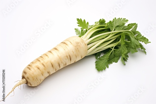 a white root vegetable with green leaves