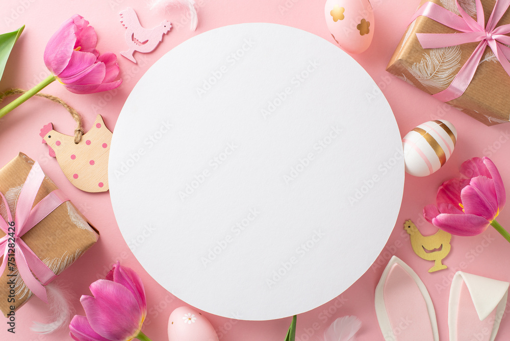 Easter happiness motif: Top view of vivid eggs, cute wooden chick decorations, kraft gift boxes with bows, playful bunny ears, and fresh tulips on pastel pink backdrop, round space reserved for words Easter happiness motif: Top view of vivid eggs, cute wooden chick decorations, kraft gift boxes with bows, playful bunny ears, and fresh tulips on pastel pink backdrop, round space reserved for words