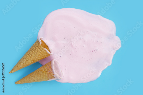 Melting ice cream on blue background.