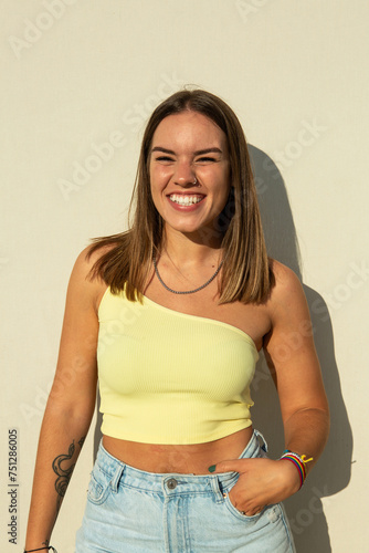 Happy woman wearing asymmetrical top photo