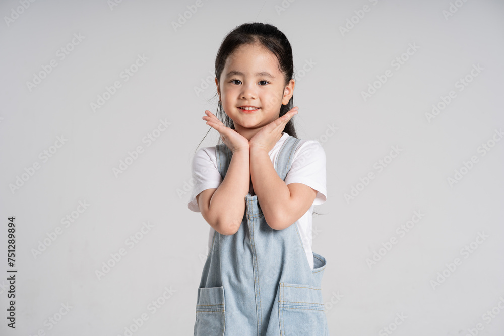 Portrait of a lovely Asian baby girl posing on a white background Portrait of a lovely Asian baby girl posing on a white background