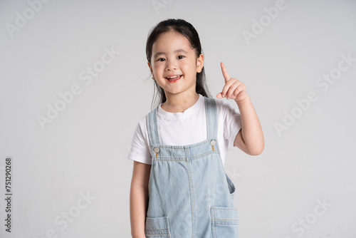 Portrait of a lovely Asian baby girl posing on a white background