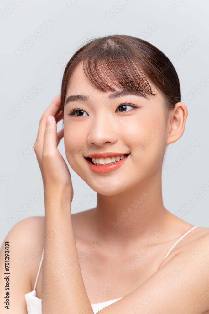 Beautiful young asian woman with clean fresh skin on white background Beautiful young asian woman with clean fresh skin on white background