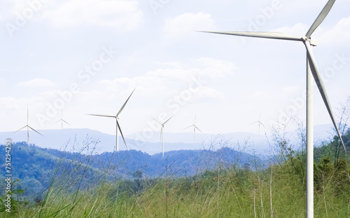 Wind Mill Power Energy Farm Generator Renewable Sustainable Field on Green Lnadscape Mountain, Environment Eco System Technology Industry Ecology Electricity Power Propeller Turbine Clean Carbon. © wing-wing