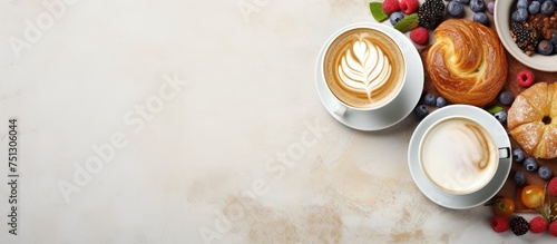 Two cups of cappuccino, a croissant, and a selection of berries laid out on a table in a top-down view. The cappuccinos are steaming, the croissant is golden-brown, and the berries add color to the