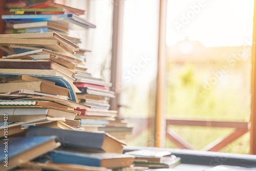 Pile of old books on the table. Lots of old books. Copy space