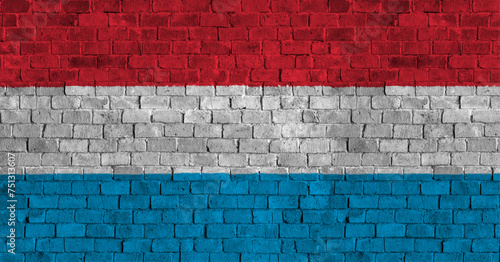 Grand Duchy of Luxembourg Flag Over a Grunge Brick Background photo
