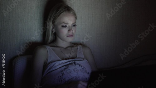 The girl is watching the finale of her favorite TV series with a sad ending.