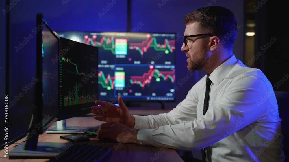 Stressed trader look at monitor screen shows the financial market chart graphic going down. Market crash, scam, bear market Stressed trader look at monitor screen shows the financial market chart graphic going down. Market crash, scam, bear market