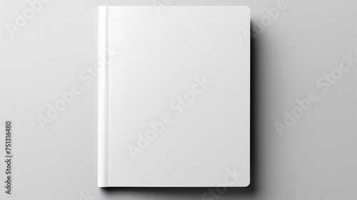 Top view of Woman's hand gracefully holding a blank white magazine on a gray background, serving as a design template mockup.