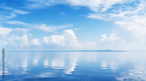 Beautiful seascape with blue sky and clouds reflected in water © pixcel3d