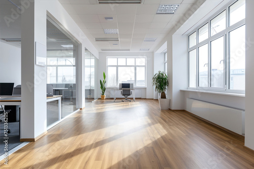 Interior of a modern office with white walls and wooden floor. Nobody inside photo