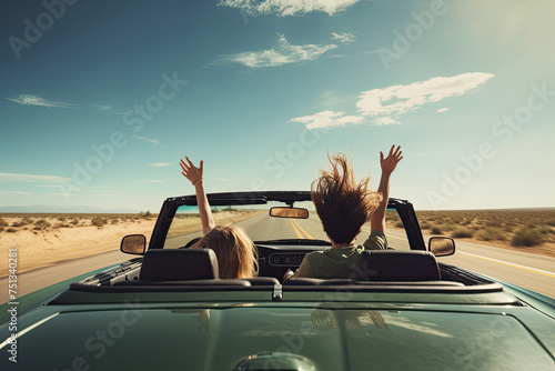 rear view photo Happy couple driving on a rural road with hands raised. Created with AI