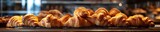 Scrumptious and flaky croissants exude warmth on a counter, evoking cozy cafe mornings