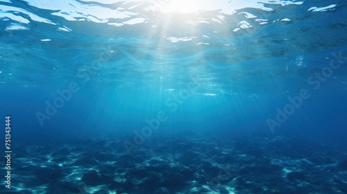 Sun rays filtering through the blue underwater seascape
