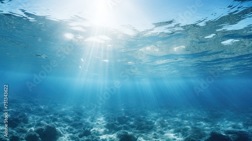 Sunbeams illuminating the navy blue underwater vista