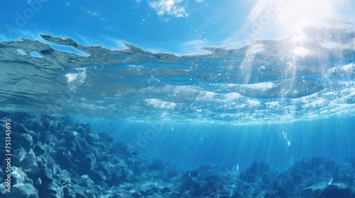 Sunlight filtering through the sapphire underwater expanse © pixcel3d