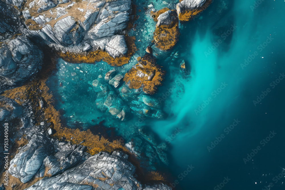 View from above of a body of water enclosed by rocky terrain - obrazy, fototapety, plakaty 