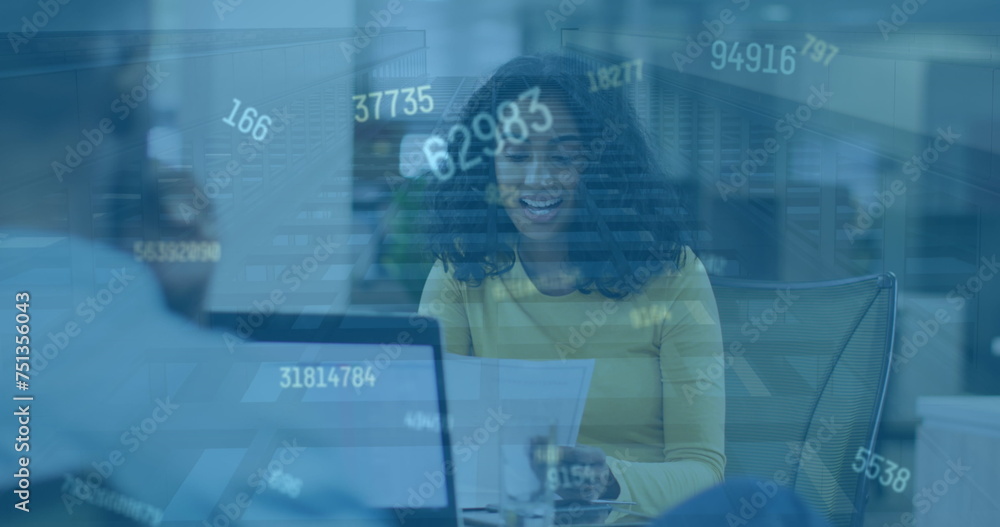 Image of numbers changing over happy biracial woman in office Image of numbers changing over happy biracial woman in office
