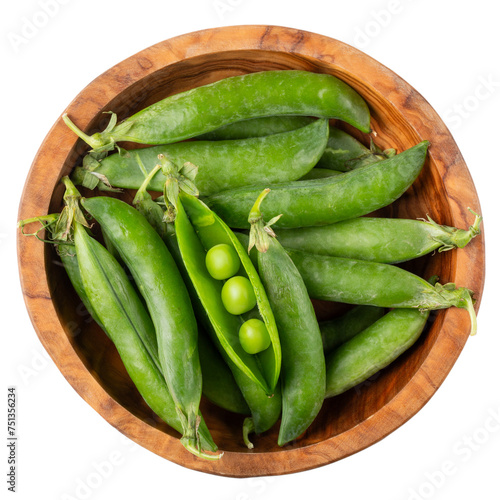 Green pea pods in wooden bowl isolated on white. Top view.