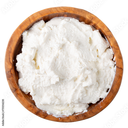Soft cheese in wooden bowl isolated on white.  Ricotta cheese. Top view.