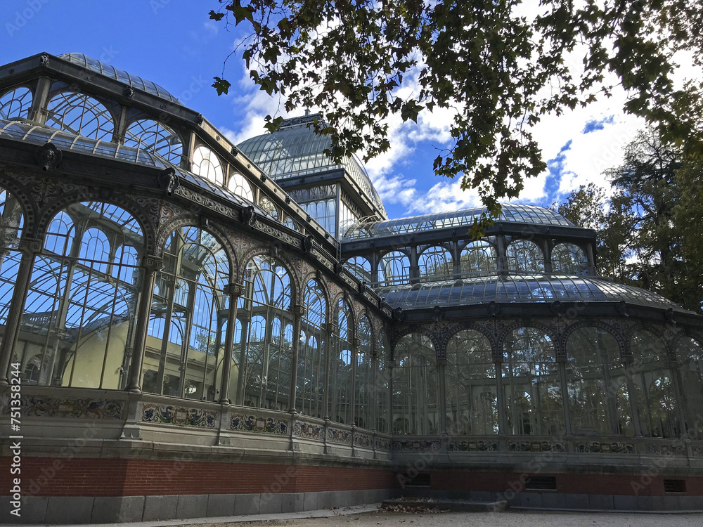 Fototapeta premium An interesting combination of glass and metal in Palacio de Cristal, originally a greenhouse, located in the de El Retiro Park in Madrid, Museu Nacional Centro de Arte Reina Sofia. Madrid, Spain.