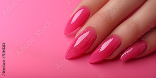 Close-Up of Manicured Fingernails on a Pink Background