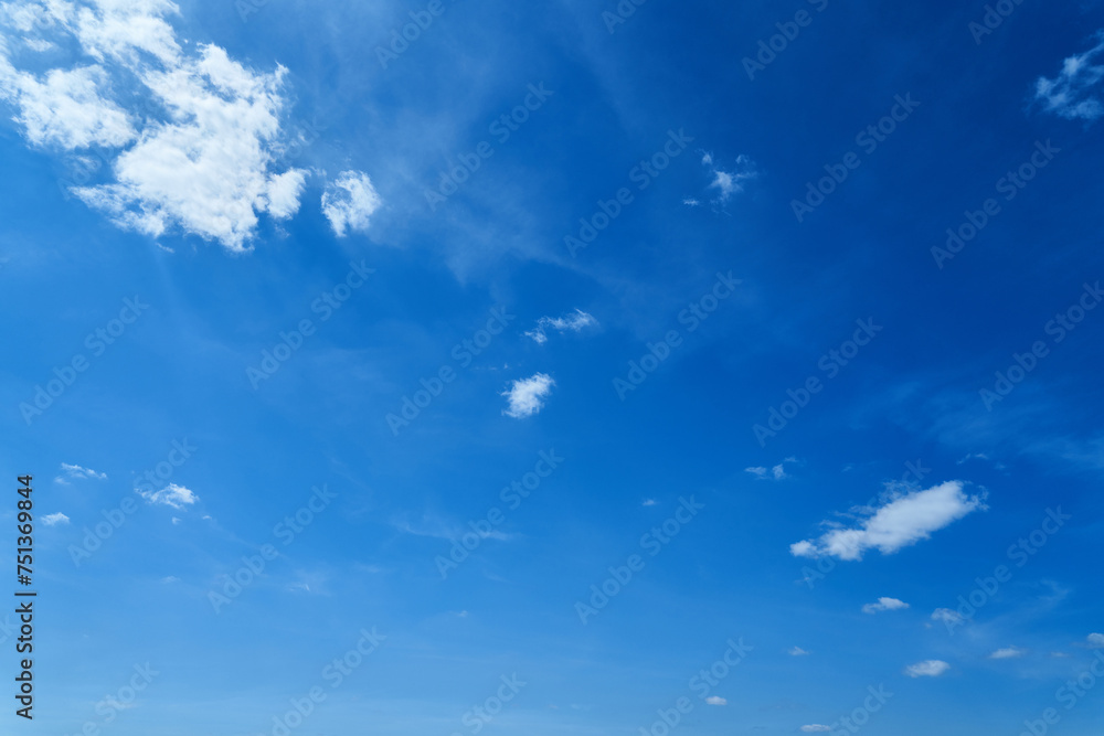 Open blue sky with little white clouds in the air Open blue sky with little white clouds in the air