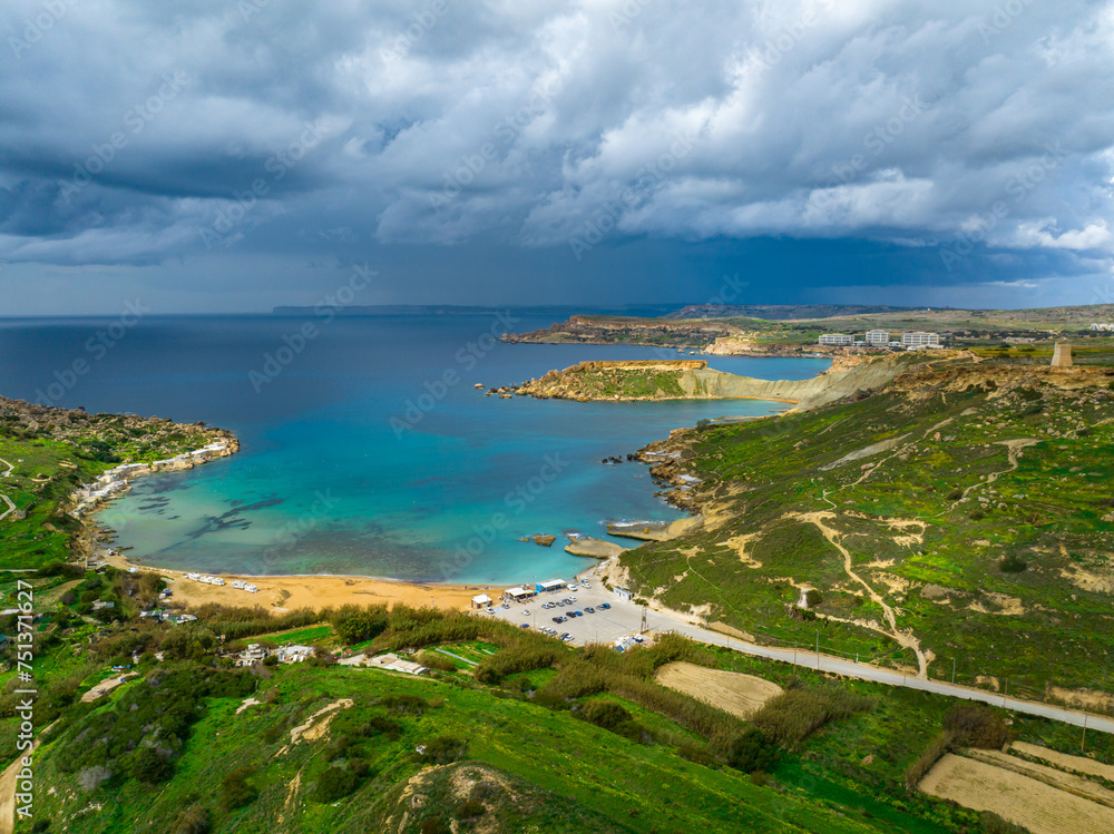 Aerial drone view of Gnejna Bay and sea, stormy winter sky. Maltese island