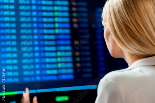 Female trader in front of the screen