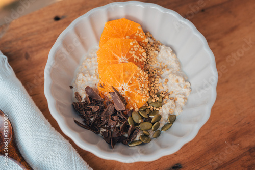 Oatmeal with chocolate orange topping and bee pollen