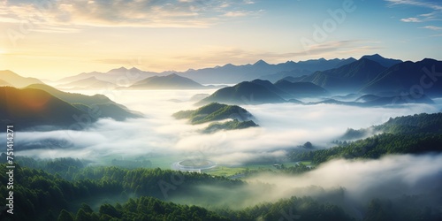 Beautiful green mountain landscape with morning sunrise sky and fog. Aerial view of green trees in tropical mountain forests and fog in winter.