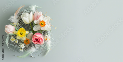 Easter card with bird nest and spring flowers, space for text.  photo