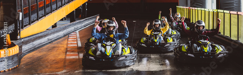 Go-Kart Racers group of young friends generation z celebrate winning race