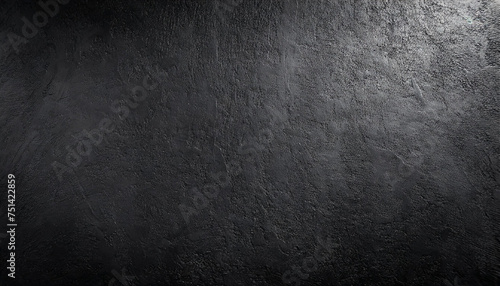 black wall rough texture background concrete floor or old grunge backdrop illuminated by sun ray close up of dark graphite surface for modern background design concept of textures and background