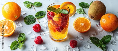 .arrangement of colorful fresh fruit around the glass. white background