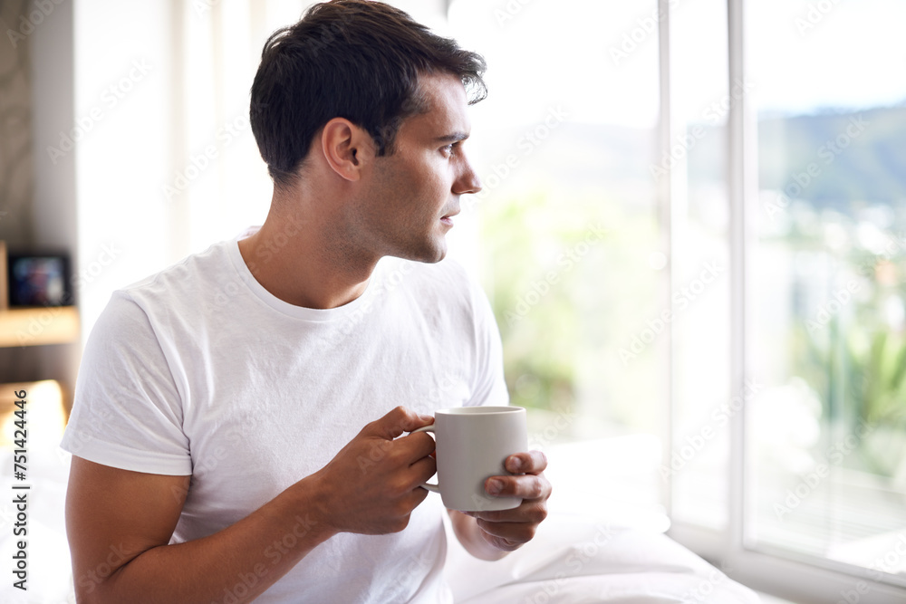 Man, coffee and bed with window for morning, wakeup, daydream or thinking with sunlight and caffeine. Young and male person with looking and relax for ponder, thought idea indoor for weekend Man, coffee and bed with window for morning, wakeup, daydream or thinking with sunlight and caffeine. Young and male person with looking and relax for ponder, thought idea indoor for weekend