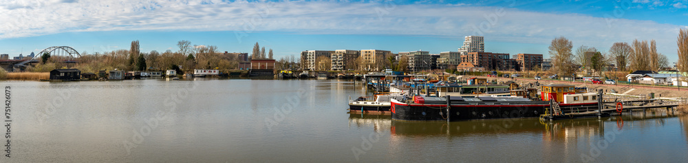 Panorama of Amsterdam-Oost, harbor at Zuider IJdijk and modern architecture of Cruquiuseiland suburb