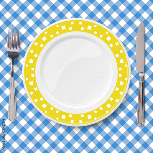 Yellow dish with pattern of chaotic white pattern placed on blue check classic table cloth