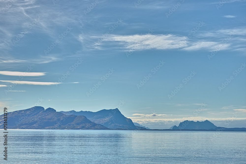 Ocean, blue sky and mountains in nature for travel, tourism destination or vacation with landscape background. Sea, surface and water reflection by island for eco friendly adventure and Norway mockup